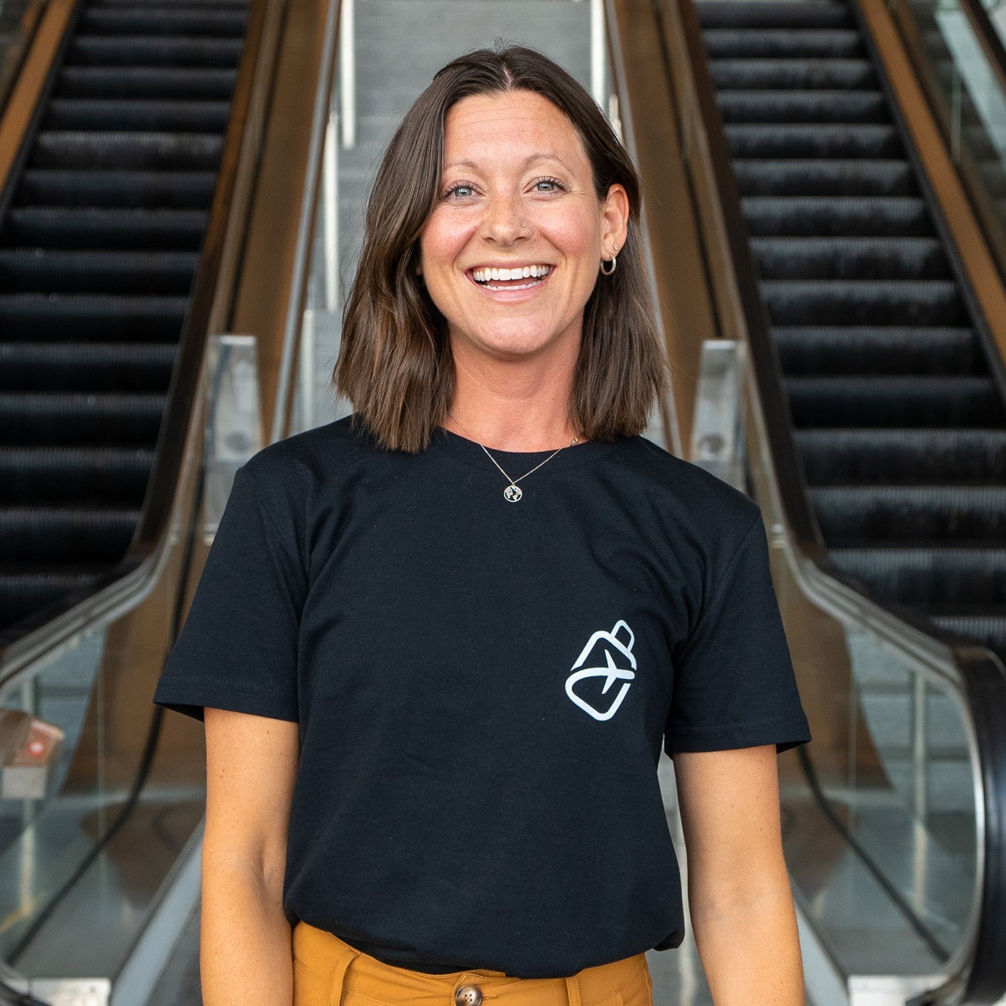 Kara wearing a black Airport Diagram T-Shirt